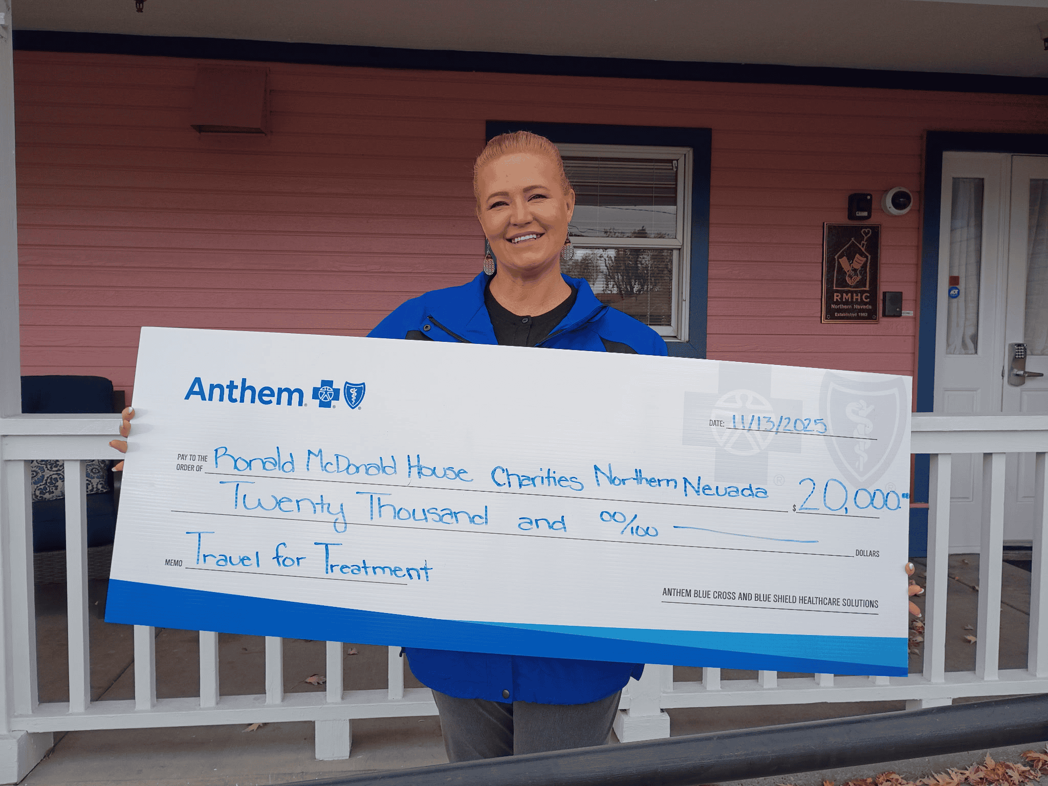 Anthem representative presenting a check.