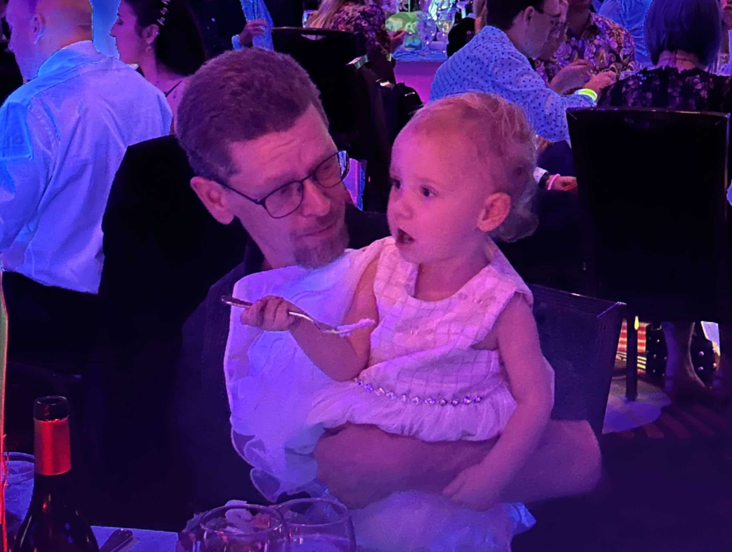 Dad with toddler at the red Shoe Gala.