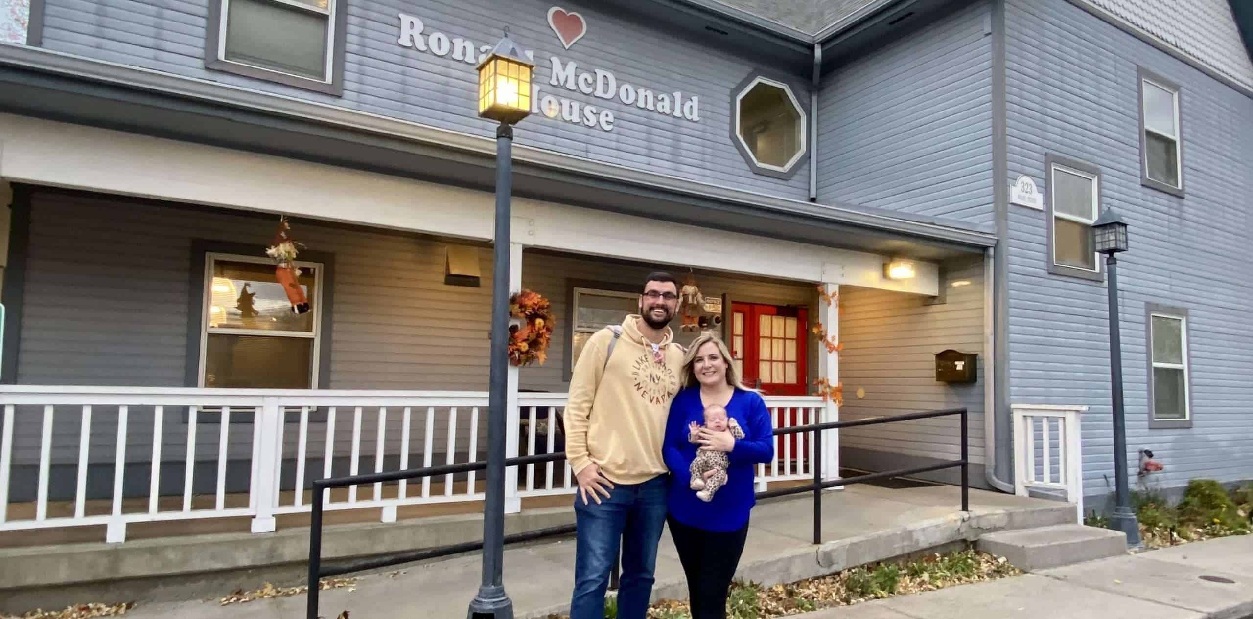 Gree, Kayla and EmJ standing in front o the Ronald McDonald House.