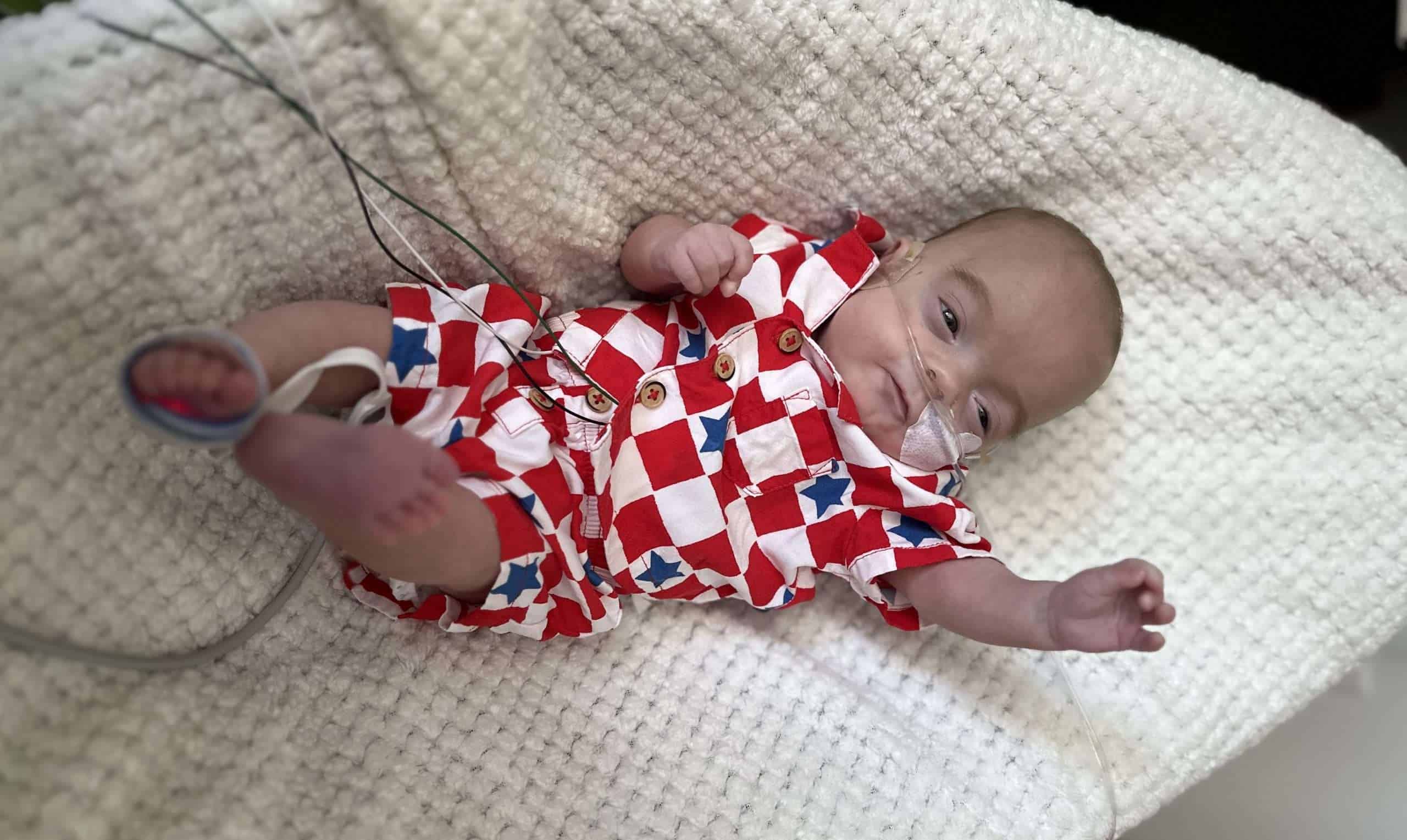 Baby Walker wearing red jammies